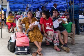 Patients wait for their turn to receive medical consultation